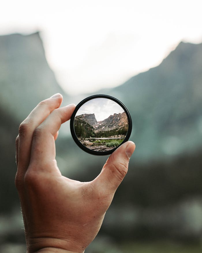Crafting Captivating Headlines: Your awesome post title goes here A stunning mountain landscape magnified through a handheld lens highlighting exploration and adventure.